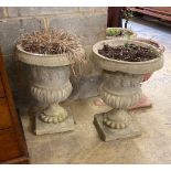 A pair of reconstituted stone campana garden urns, diameter 41cm, height 56cm