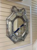 A Venetian octagonal engraved wall mirror with floral scroll pediment and bevelled central plate,