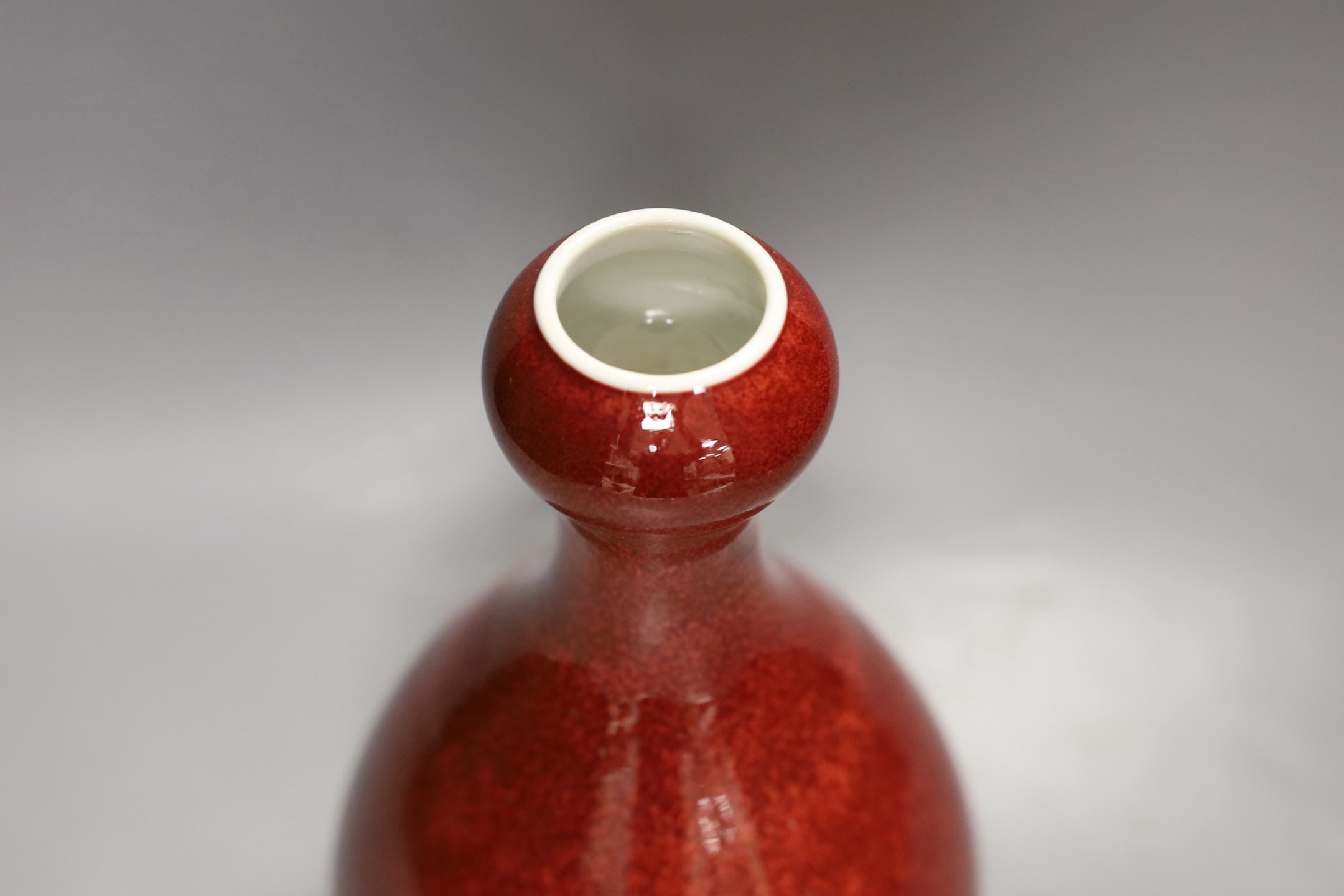 A Chinese sang de boeuf glazed vase 26 cms high. - Image 2 of 3