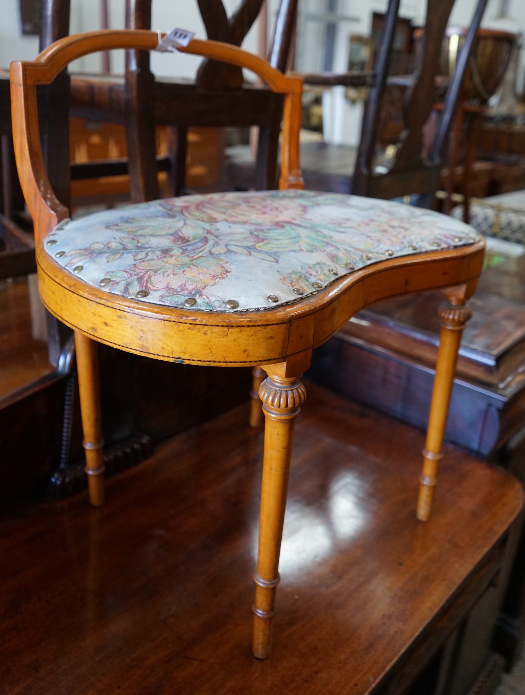 An Edwardian Sheraton revival satinwood dressing stool, width 61cm, depth 40cm, height 67cm**