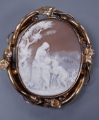 A Victorian yellow metal mounted oval cameo shell brooch, carved with Madonna and child with a young