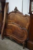 An early 20th century French walnut double bed frame, width 152cm, height 165cm**CONDITION REPORT**