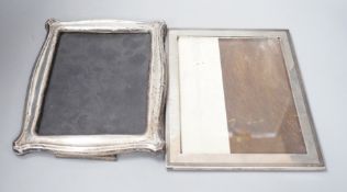 A George V silver mounted rectangular photograph frame, Chester 1922, 23.6cm and a shaped