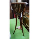 An Edwardian satinwood banded mahogany jardiniere with brass liner, diameter 35cm, height 85cm.**