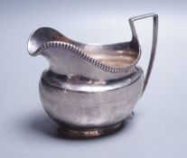 A George III silver cream jug, Thomas Law, Sheffield, 1808, height 9.8cm, 122 grams.**CONDITION