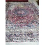 An antique Heriz red ground carpet, 420 x 306cm**CONDITION REPORT**Severely worn in several large