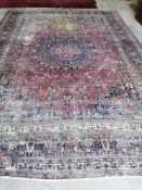 An antique Heriz red ground carpet, 420 x 306cm**CONDITION REPORT**Severely worn in several large