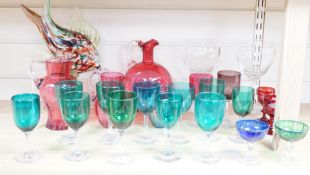 A quantity of cranberry glass, together with other coloured glassware and a Murano style fish