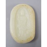 A Chinese celadon jade pebble carving depicting Guanyin, 7.5cm tall**CONDITION REPORT**PLEASE NOTE:-