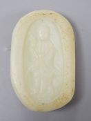 A Chinese celadon jade pebble carving depicting Guanyin, 7.5cm tall**CONDITION REPORT**PLEASE NOTE:-