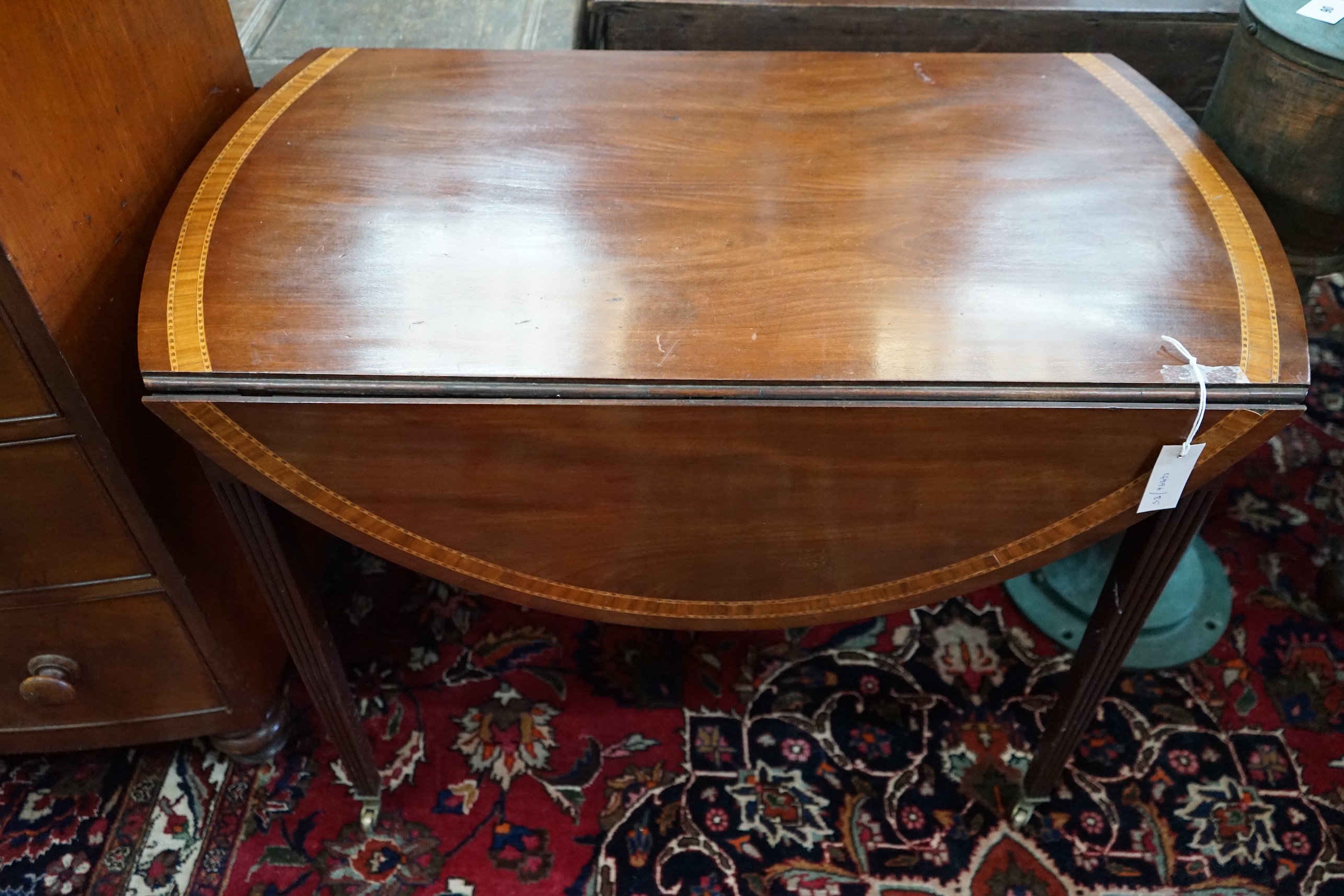 A George III and later satinwood banded mahogany oval Pembroke table, width 99cm, depth 56cm, height