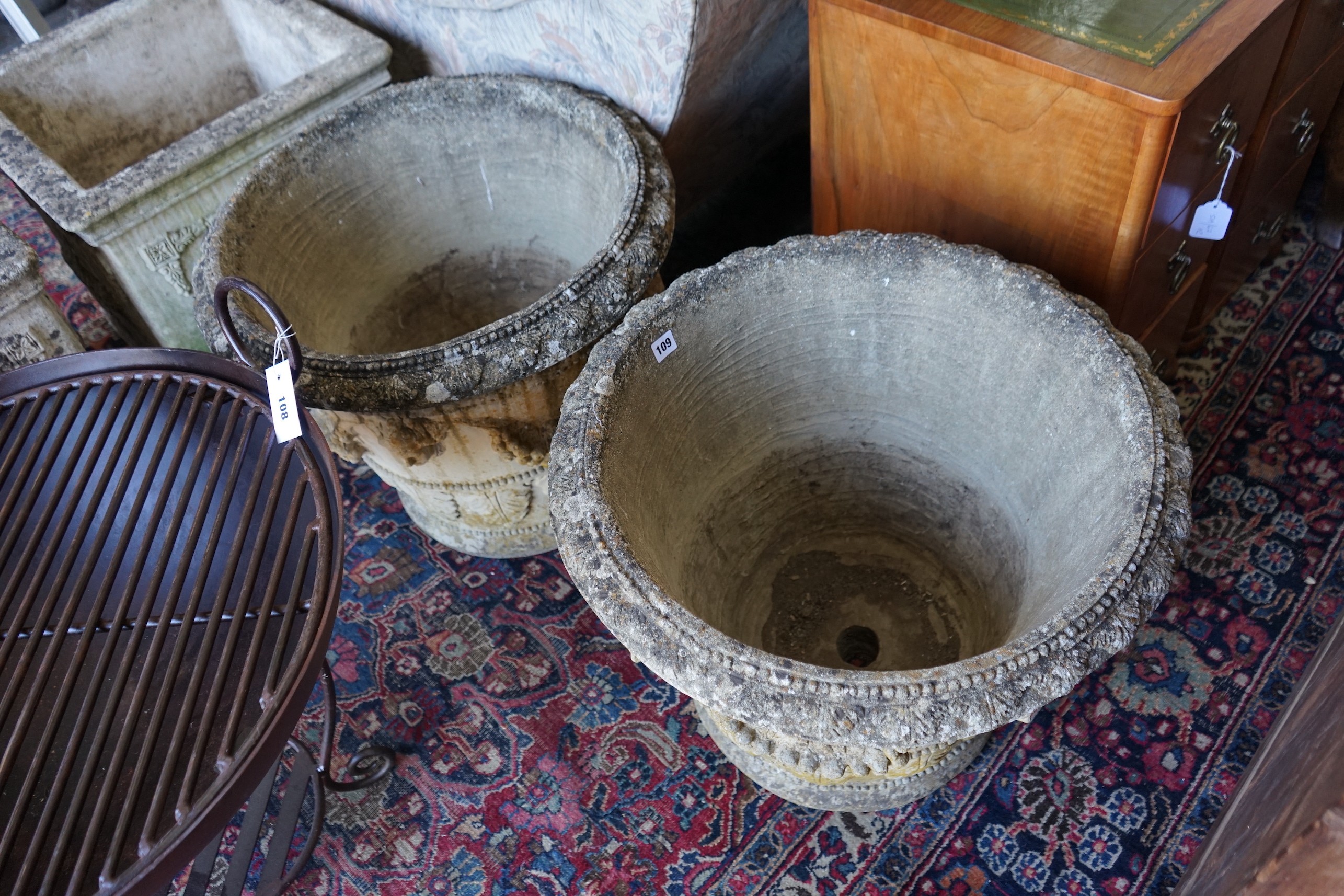 A pair of circular reconstituted stone garden planters with fruit swagged mask bodies, diameter - Image 2 of 3