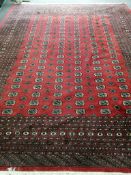 A Bokhara red ground carpet, 360 x 284cm**CONDITION REPORT**PLEASE NOTE:- Prospective buyers are