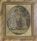 A gilt framed Regency oval silkwork picture of a classical maiden scattering flowers at a tomb,