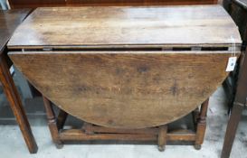An 18th century oak gateleg dining table, length 103cm, depth 44cm, height 72cm**CONDITION REPORT**