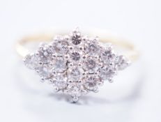 A modern 18ct gold and diamond set marquise shaped cluster ring, size M, gross weight 2.9 grams,
