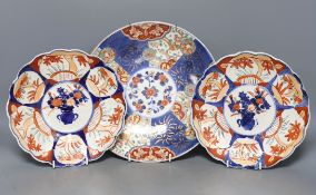 A pair of Japanese Imari plates and similar dish, 27cm**CONDITION REPORT**PLEASE NOTE:-