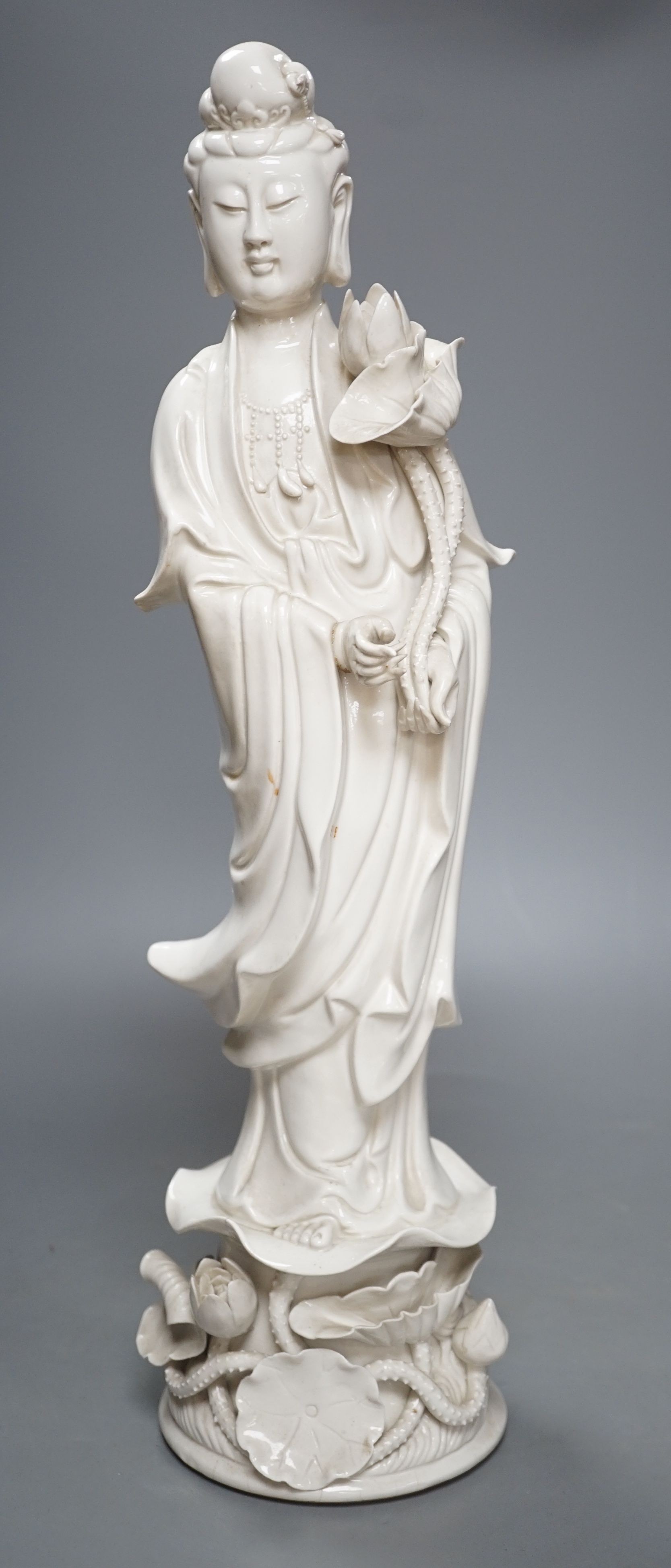 A tall Chinese blanc de chine figure of Guanyin -47cm high**CONDITION REPORT**PLEASE NOTE:-