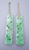 A pair of carved jade earrings, lacking mounts, 37mm.**CONDITION REPORT**PLEASE NOTE:- Prospective
