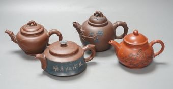 A group of four Yixing pottery teapots - tallest 11cm**CONDITION REPORT**PLEASE NOTE:- Prospective