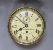 A brass ship’s bulkhead timepiece with key**CONDITION REPORT**PLEASE NOTE:- Prospective buyers are
