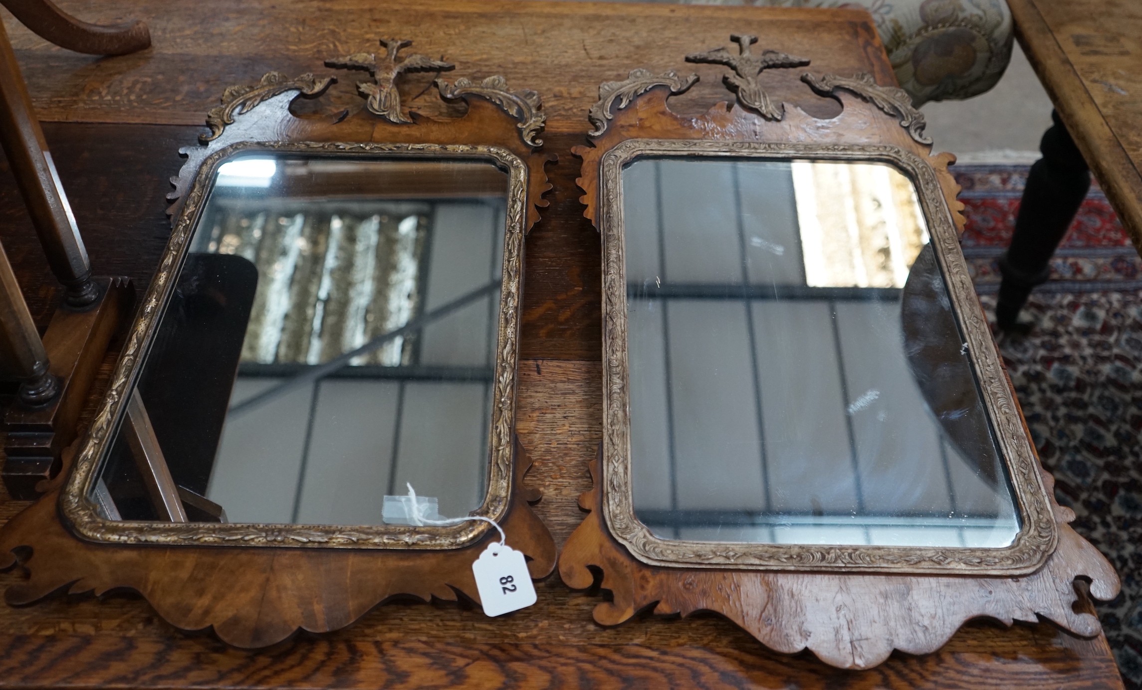A pair of George III style yew fret cut wall mirrors, width 40cm, height 76cm**CONDITION REPORT**