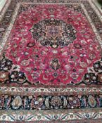 A Heriz red ground floral carpet, 400 x 298cm**CONDITION REPORT**PLEASE NOTE:- Prospective buyers