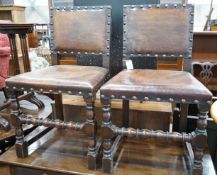 A set of six Carolean style oak and studded leather dining chairs**CONDITION REPORT**PLEASE NOTE:-