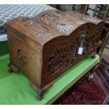 A Chinese carved camphorwood coffer with domed cover, length 93cm, depth 43cm, height 55cm**