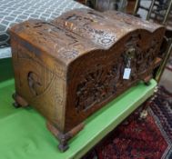 A Chinese carved camphorwood coffer with domed cover, length 93cm, depth 43cm, height 55cm**