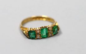 An Edwardian 18ct gold, thee stone green doublet and rose cut diamond chip set half hoop ring,