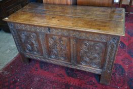 A late 17th /early 18th century carved oak panelled coffer, length 128cm, depth 58cm, height 72cm**