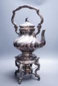 A late 19th century Italian 800 standard white metal tea kettle on stand with burner, of spiral pear