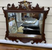 A George III style mahogany and parcel gilt fret cut wall mirror, width 58cm, height 56cm**CONDITION