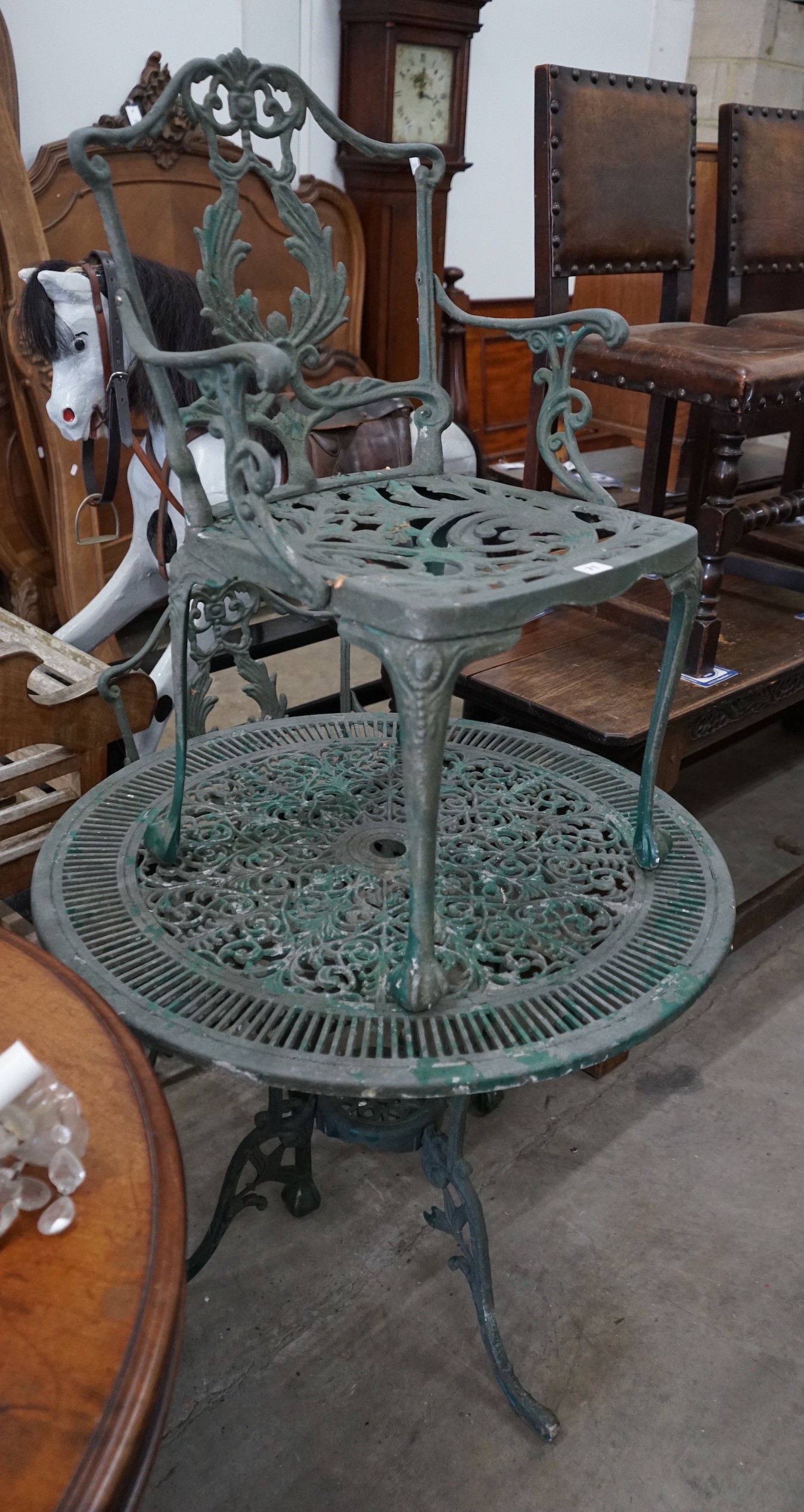 A painted aluminium circular garden table and two chairs, width 80cm, height 69cm**CONDITION