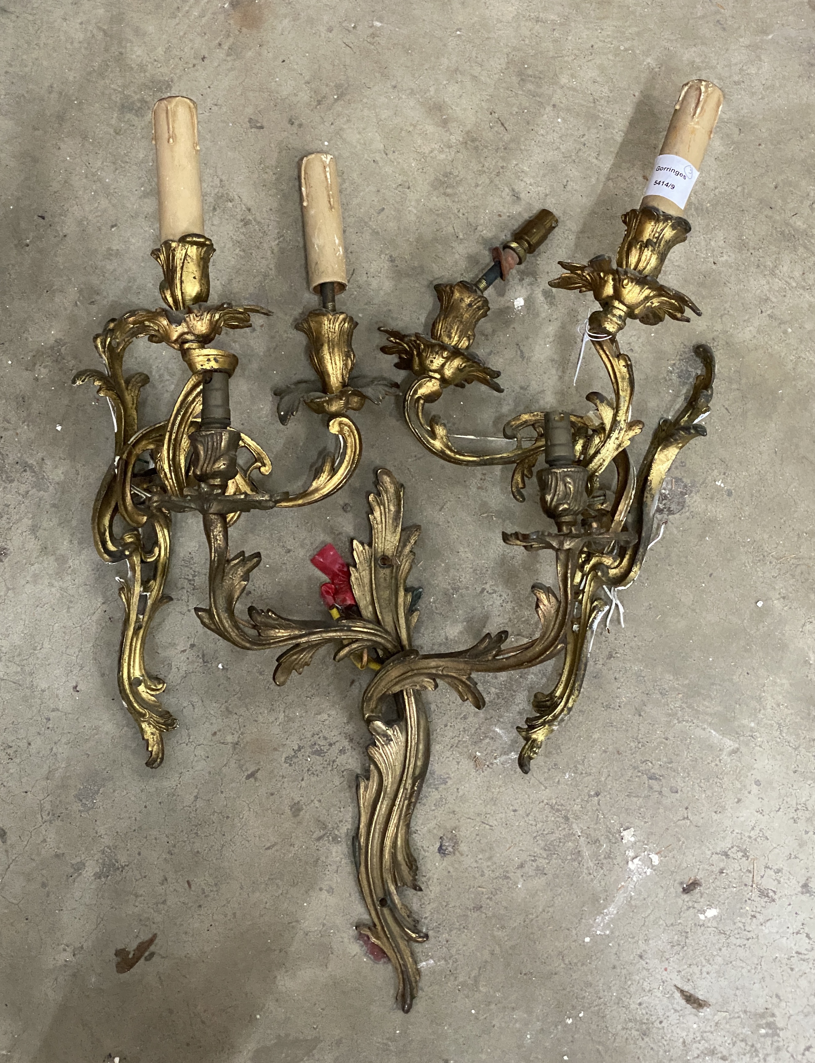 A set of three rococo style gilt metal twin branch wall lights, height 45cm**CONDITION REPORT** - Image 2 of 3