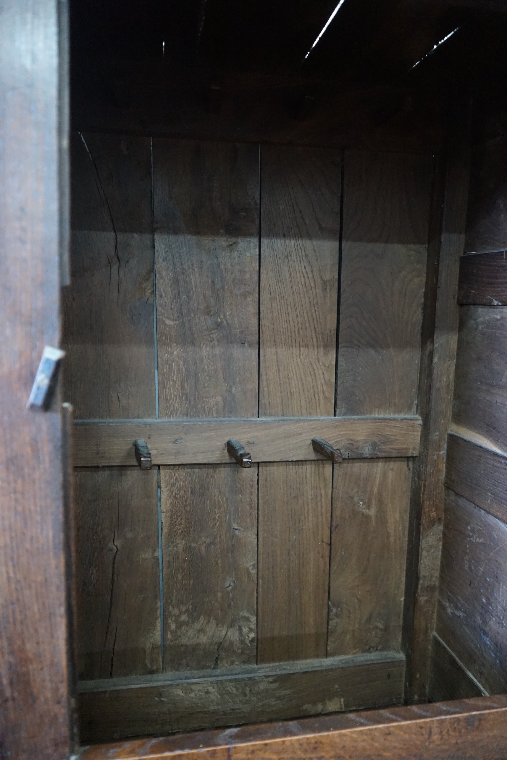 An 18th century panelled oak press cupboard, width 140cm, depth 56cm, height 185cm**CONDITION - Image 2 of 2