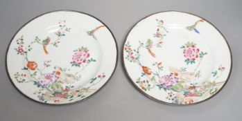 A pair of Chinese Qianlong famille rose plates, damage , 23cm diameter