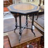 A late Victorian ebonised and amboyna octagonal centre table, width 56cm, height 64cm