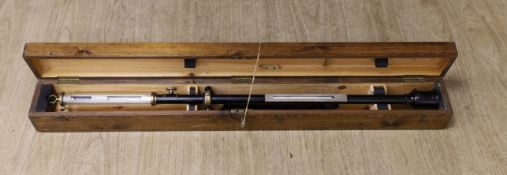 A 20th century marine barometer in a pine case,barometer 39 cms long,