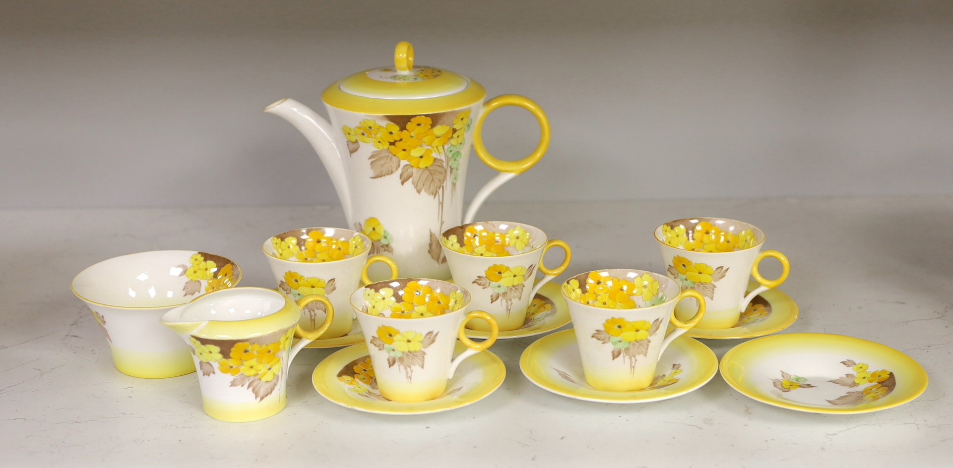 A Shelley “Yellow Phlox”, part tea service, one cup missing and one cup cracked,