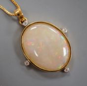 A modern 9k single stone white opal and four stone diamond set oval pendant, overall 42mm, on a gilt