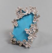 A large modern 14k white metal, turquoise and diamond chip set dress ring, the rectangular '