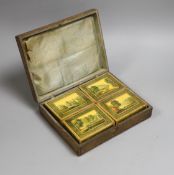 A 19th century Belgian stained sycamore box containing four counter boxes with named views, with