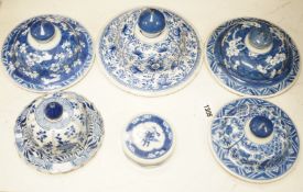 Six Chinese Kangxi blue and white vases and jar covers, largest 21.5cm diameter.Provenance - D.C.