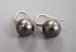 A modern pair of 585 yellow metal and Tahitian style South Sea pearl earrings, diameter approx. 11.