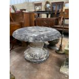 A circular reconstituted stone garden table, diameter 90cm, height 62cm