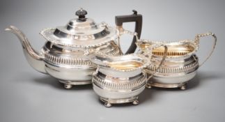 A George V silver three piece tea set, with fluted band, Nathan & Hayes, Chester, 1913/4, gross 37.