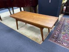 A Danish rectangular teak metamorphic coffee / dining table by Niels Bach, smallest dimensions width