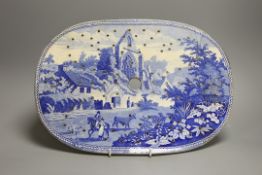 An early 19th century Staffordshire blue and white mazarine drainer, 38cm